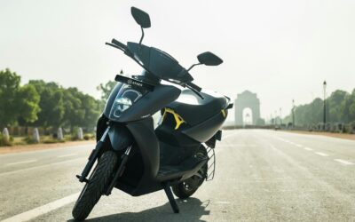 Modern electric scooter on an urban road symbolizing India’s transition to sustainable mobility.